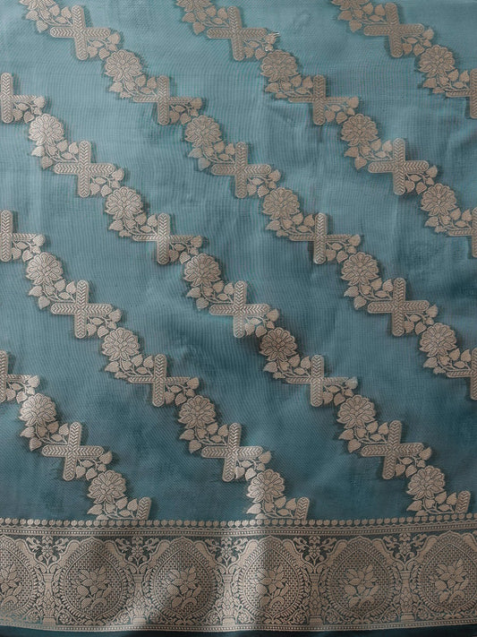 Woven fabric with silver patterns on a blue background