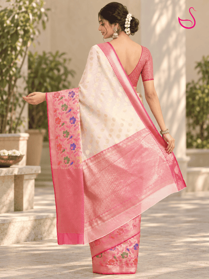 Cream saree back pose with pink floral woven pallu, zari border and matching pink blouse, outdoor styling